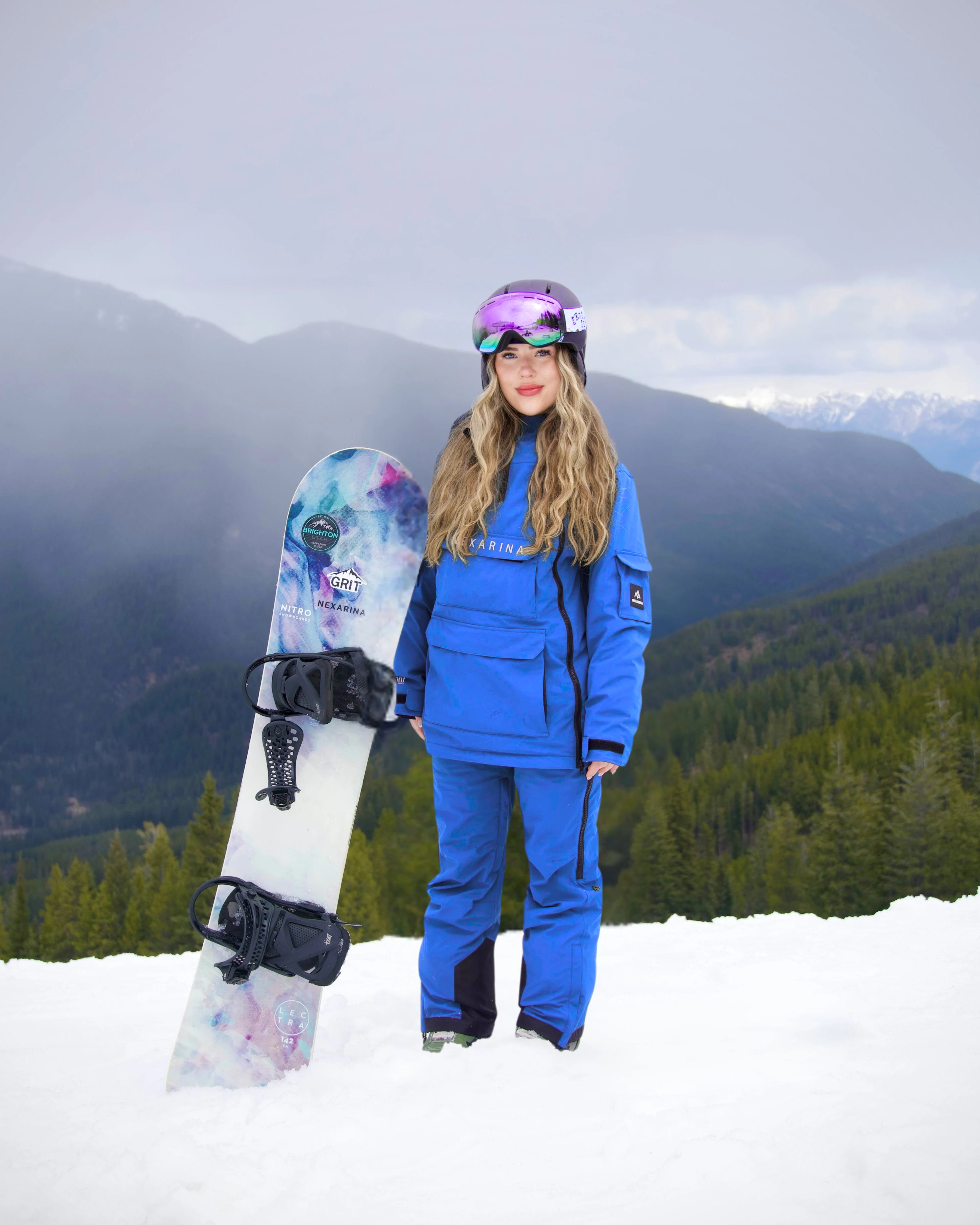 Nexarina Everette bib pants in Arctic Blue, designed for women snowboarders and skiers.