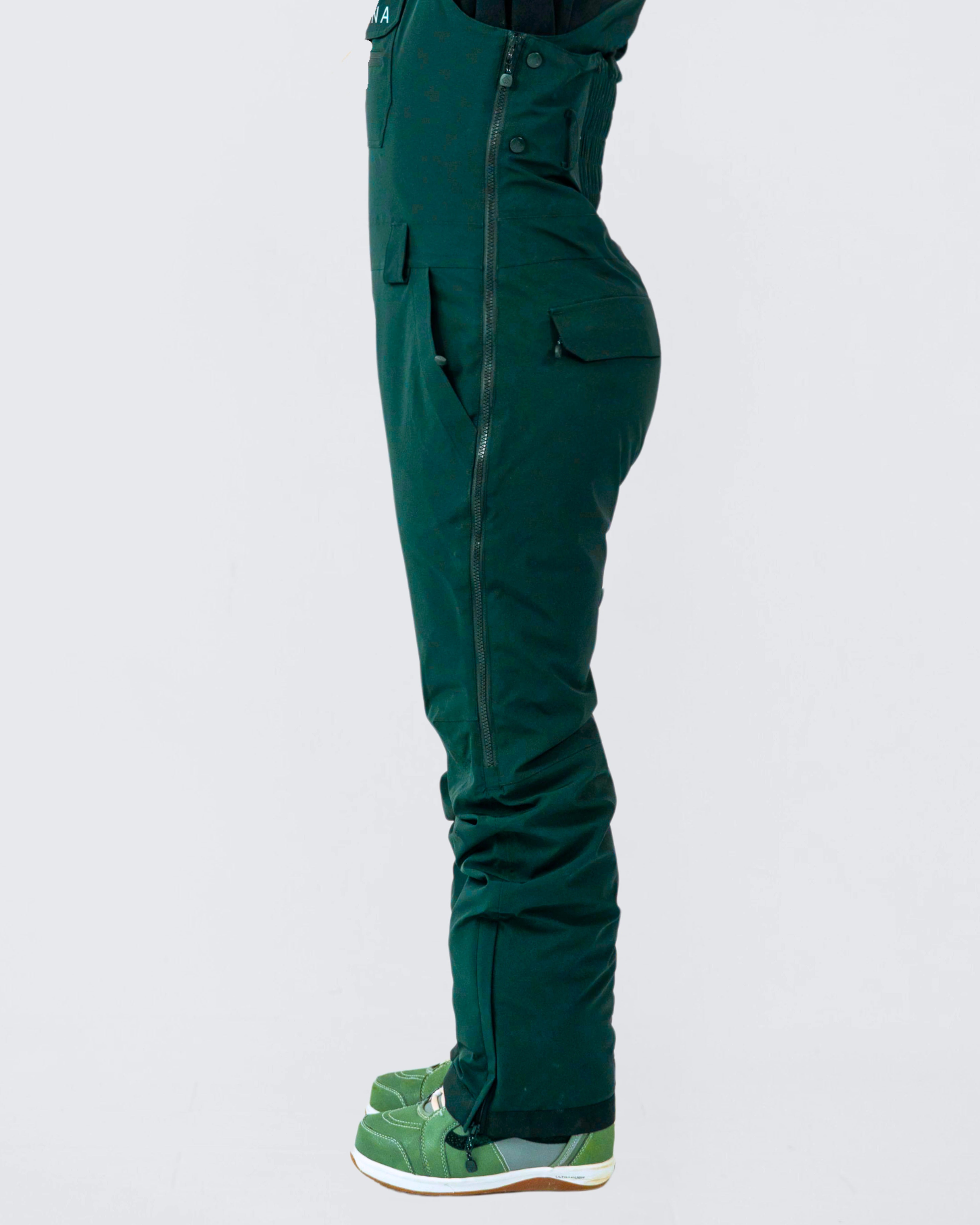 Emerald green women's snow bibs with adjustable fit, breathable and waterproof for skiing and snowboarding