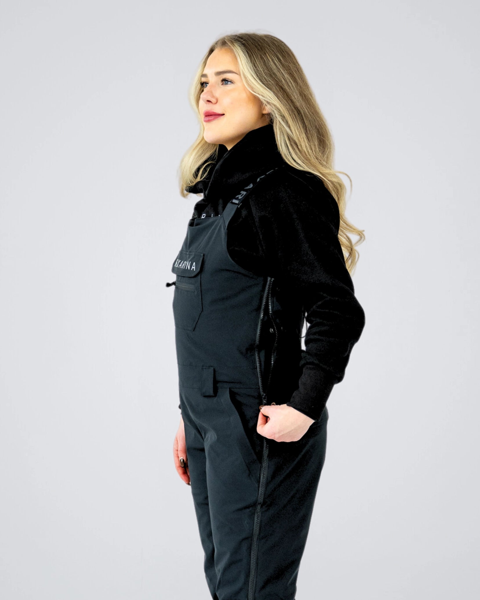 Close-up side view of Nexarina Everette Bib showing zip ventilation and side entry.
