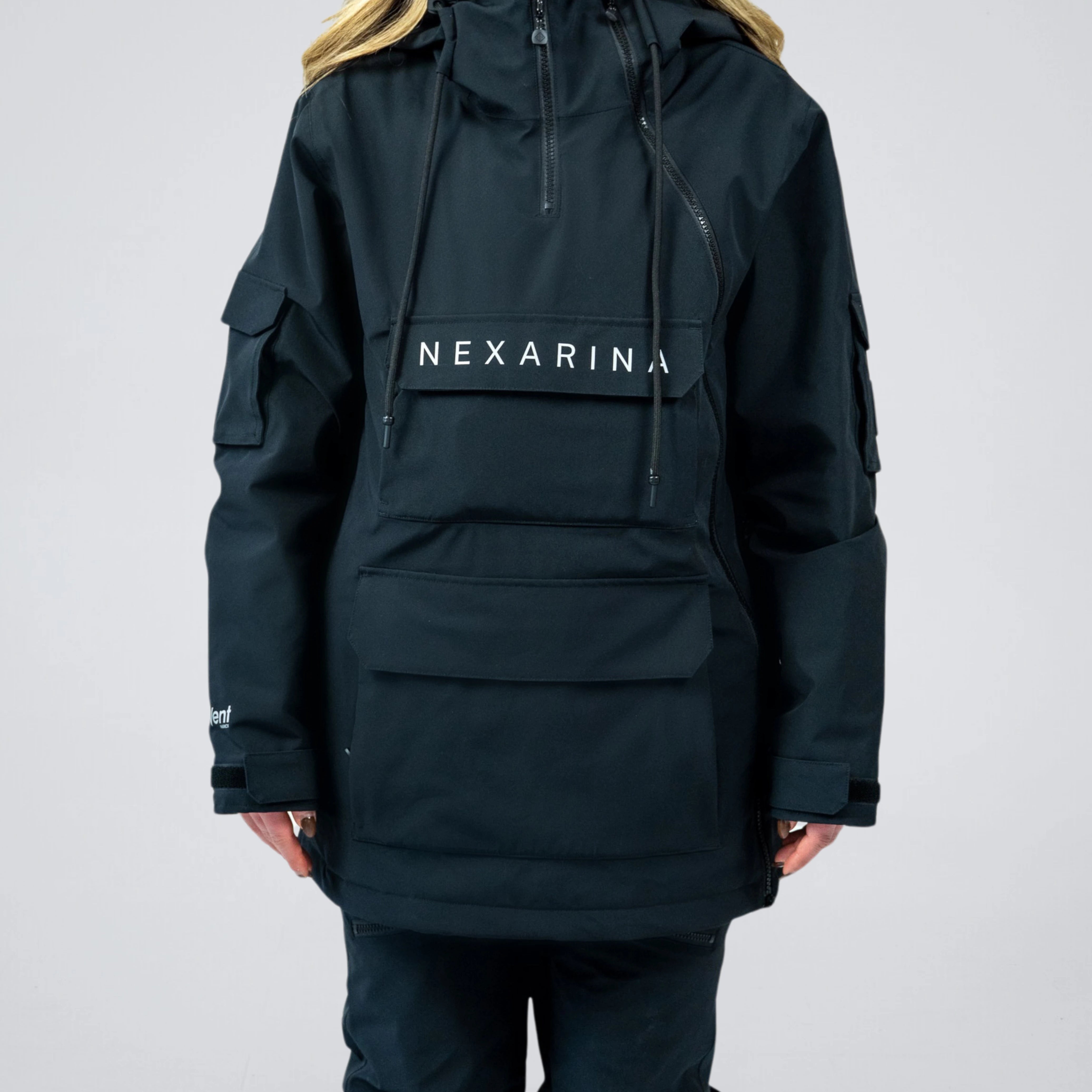 Close-up of Nexarina logo and front pocket on black Indy snow jacket