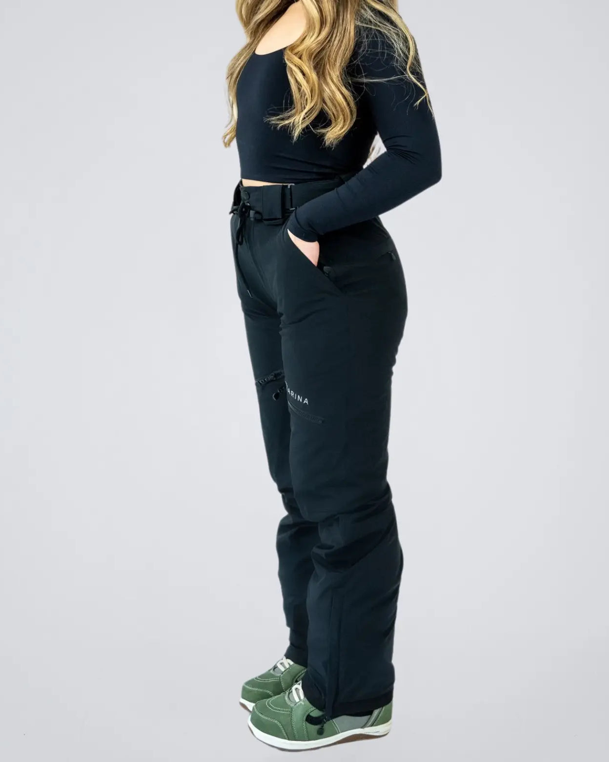Side profile of Nexarina Avani Snow Pant showing tailored fit and functional design.