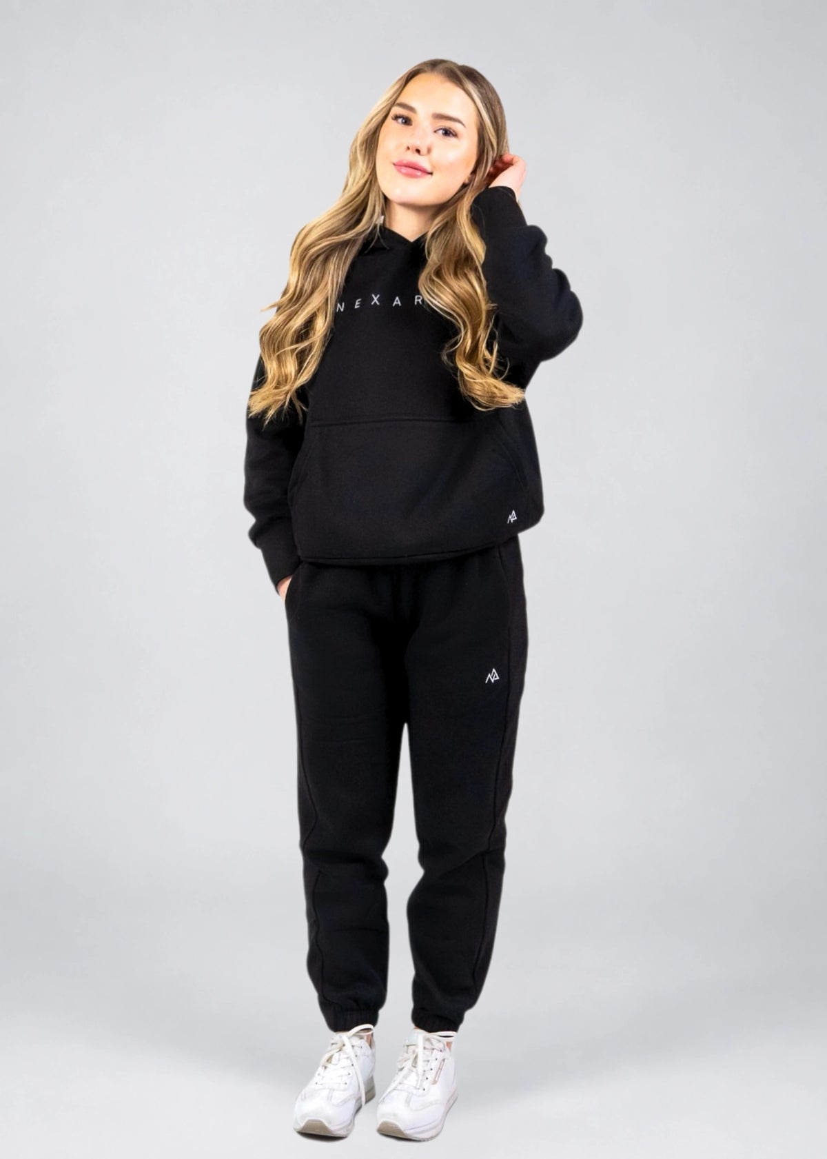 Women's Everly Hoodie in Midnight Black shown full length with matching black sweatpants.