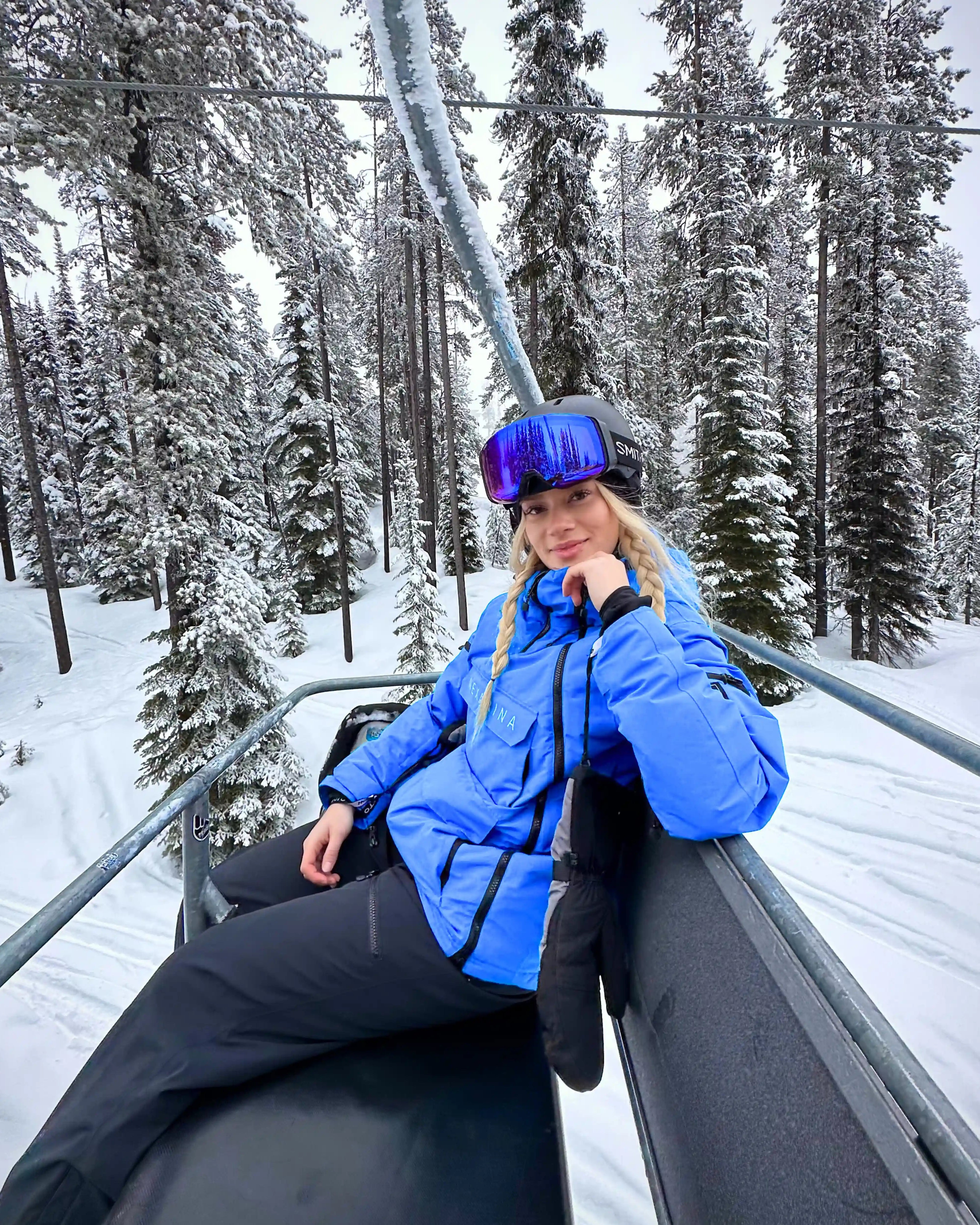 Woman wearing Nexarina Indy Jacket -Arctic Blue technical women’s snow gear.