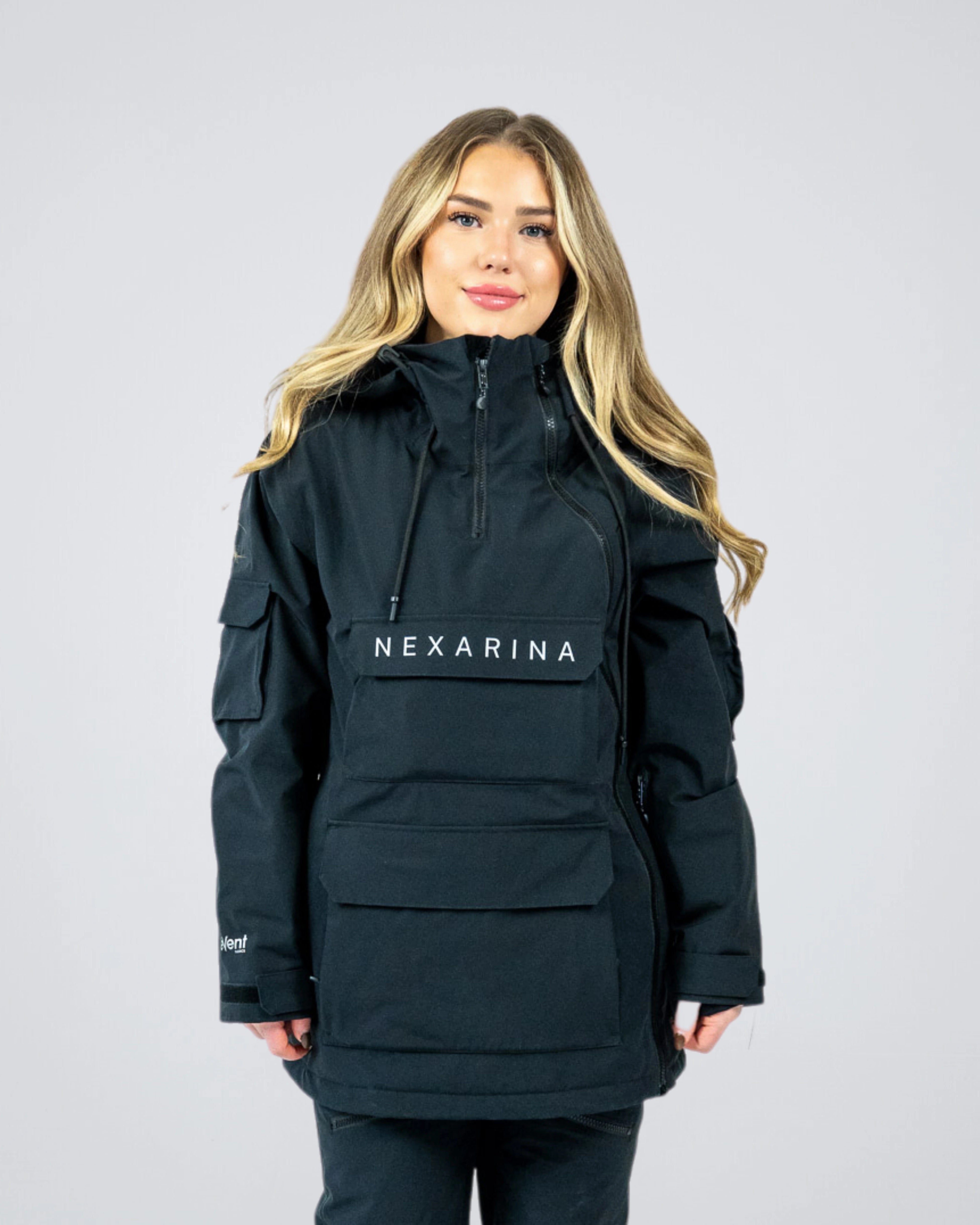 Woman wearing Nexarina Indy Snow Jacket in Classic Black, front-facing studio shot showing full fit and design.