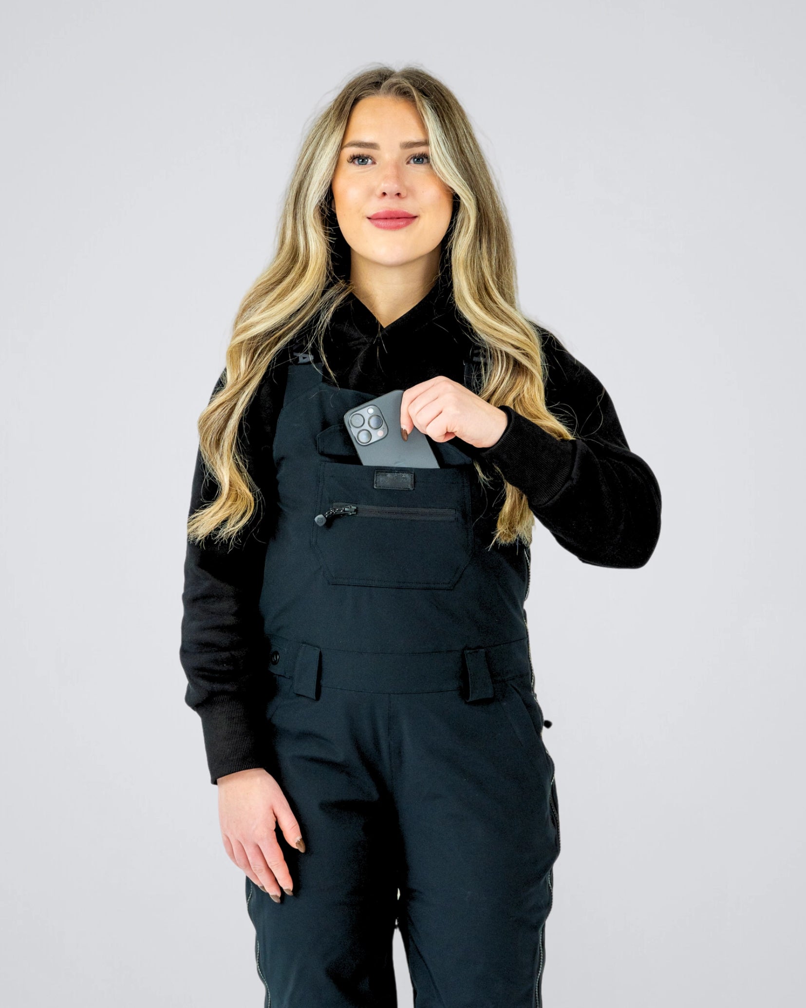 Front view of Nexarina Everette Bib highlighting performance fit and phone pocket.