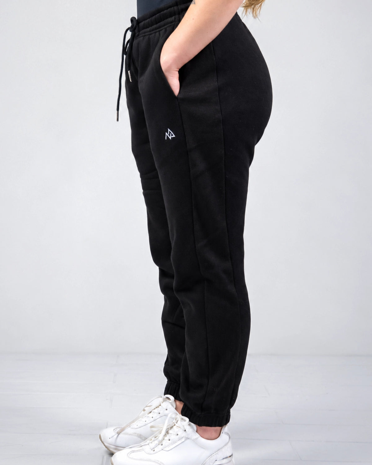 Side profile of Nexarina Willow Sweatpants showing the ribbed side panel