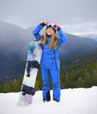 Women's Arctic Blue snow bib pants with Nexarina logo, technical outerwear for snowboarding and skiing.