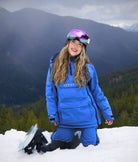 Nexarina Arctic Blue snowboarding bib shown in outdoor winter setting.