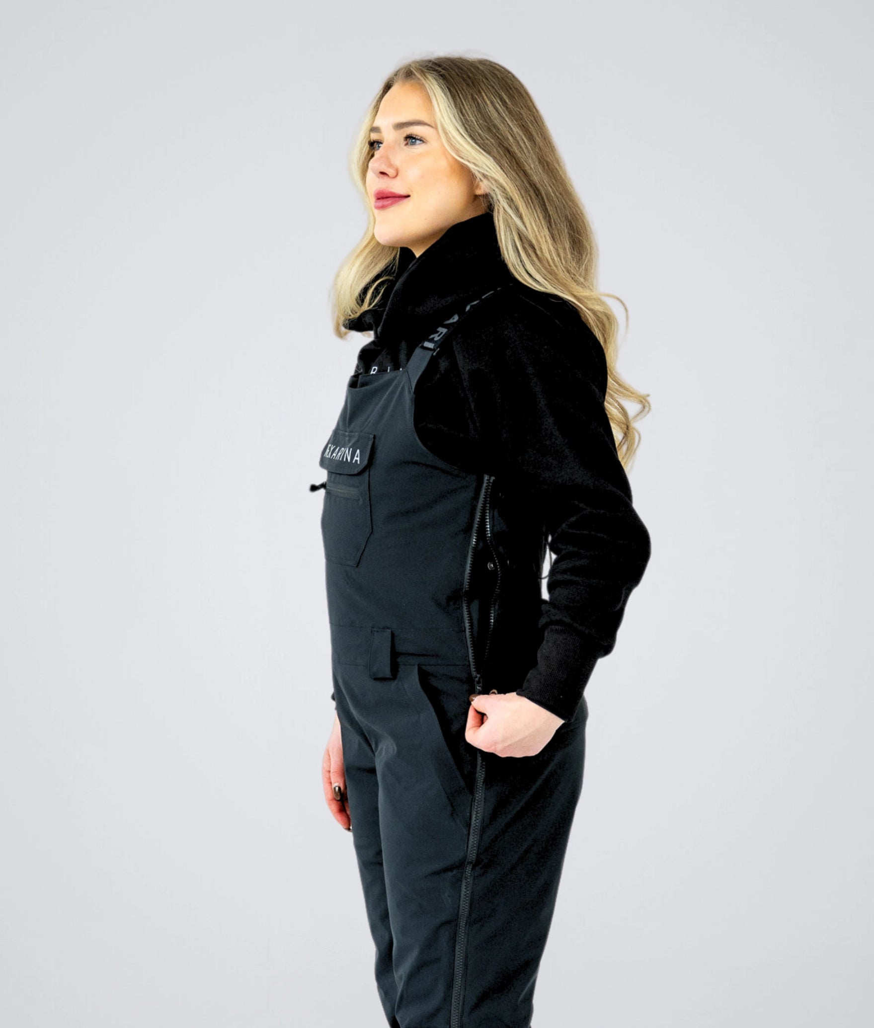 Close-up side view of Nexarina Everette Bib showing zip ventilation and side entry.