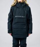 Close-up of Nexarina logo and front pocket on black Indy snow jacket