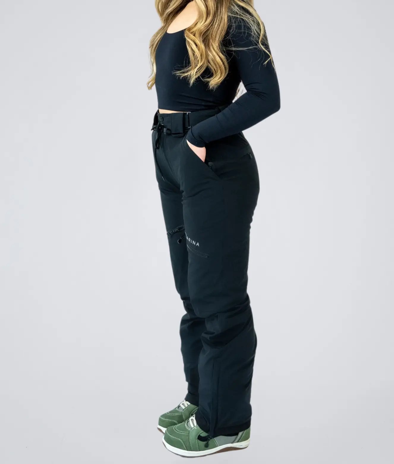 Side profile of Nexarina Avani Snow Pant showing tailored fit and functional design.