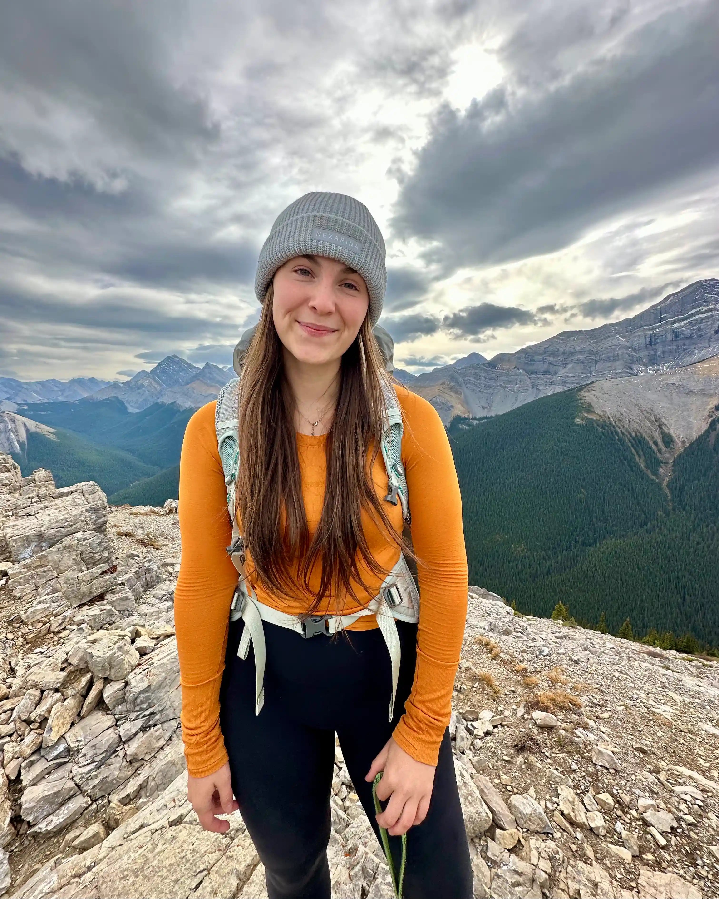 Woman wearing a Nexarina Bliss beanie outdoors