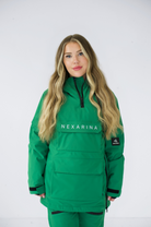 Model showcasing the green Nexarina Indy snow jacket from the front, standing straight