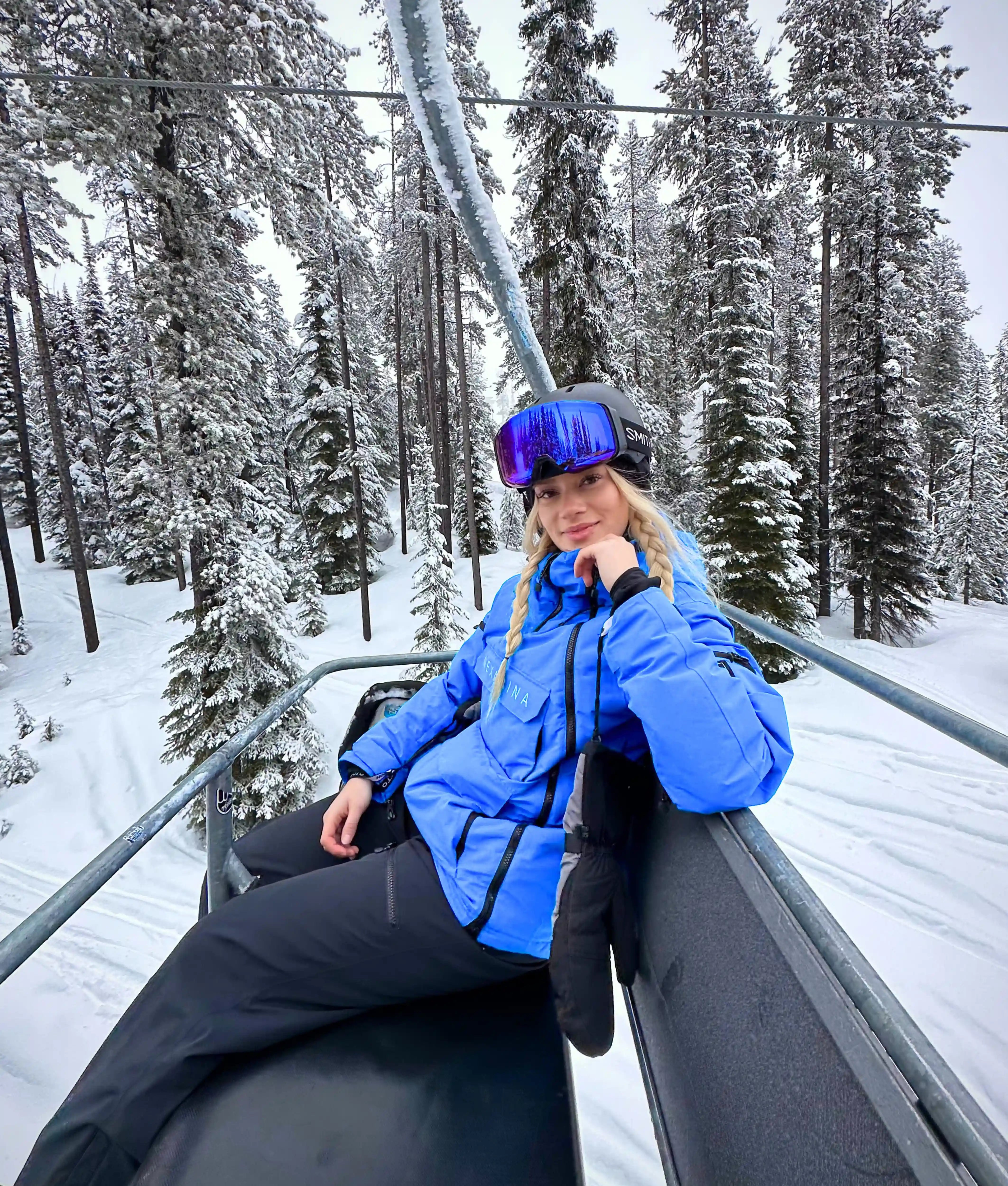 Woman wearing Nexarina Indy Jacket -Arctic Blue technical women’s snow gear.