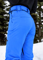 Rear three-quarter view of Nexarina Avani Arctic Blue women's snow pants showing the fitted waist and leg design.