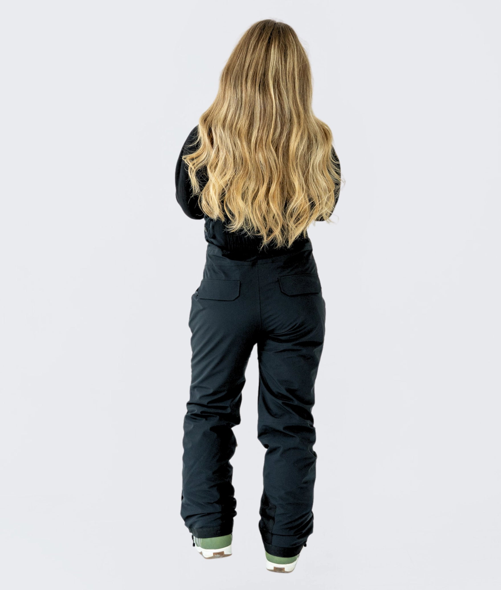 Back view of Nexarina Everette Bib showcasing tailored fit and back pocket details.