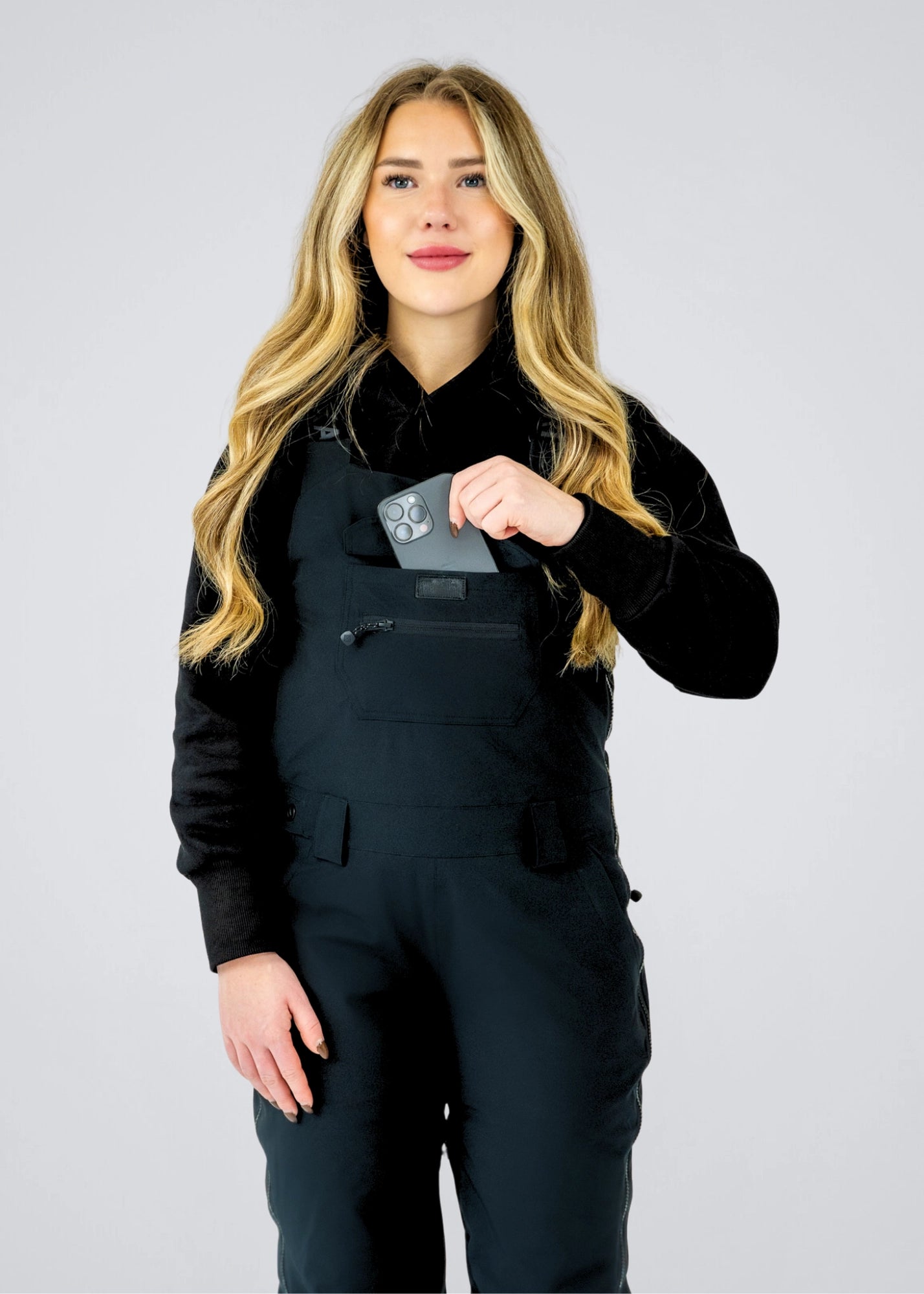 Nexarina Everette women's black snowboard bib pants chest pocket detail