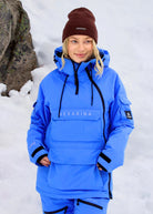 Front view of Nexarina Indy Arctic Blue women's insulated ski jacket, showing the adjustable hood, front pockets and relaxed fit.