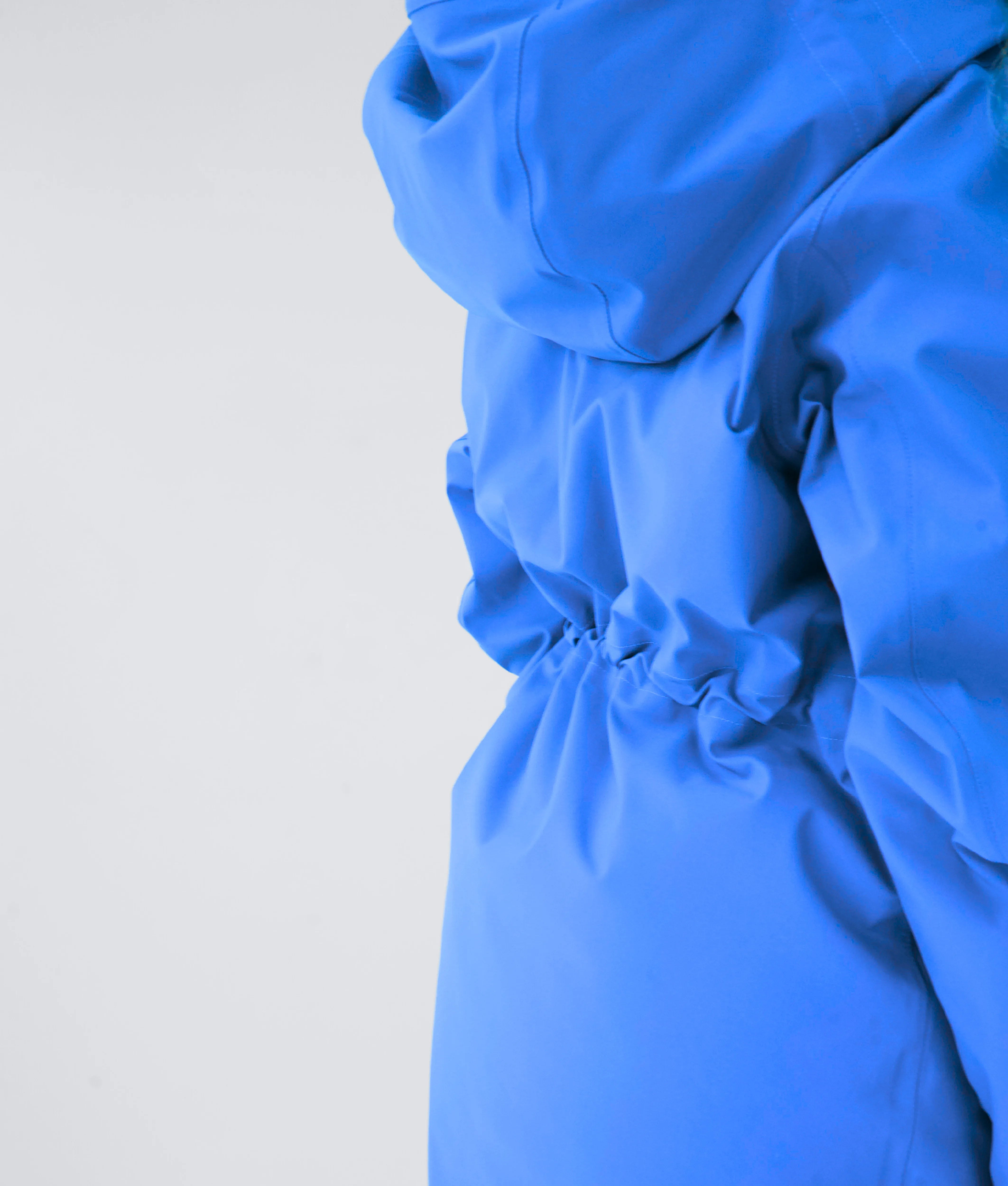 Close-up of Nexarina Indy Jacket in Arctic Blue showing cinch-waist feature.