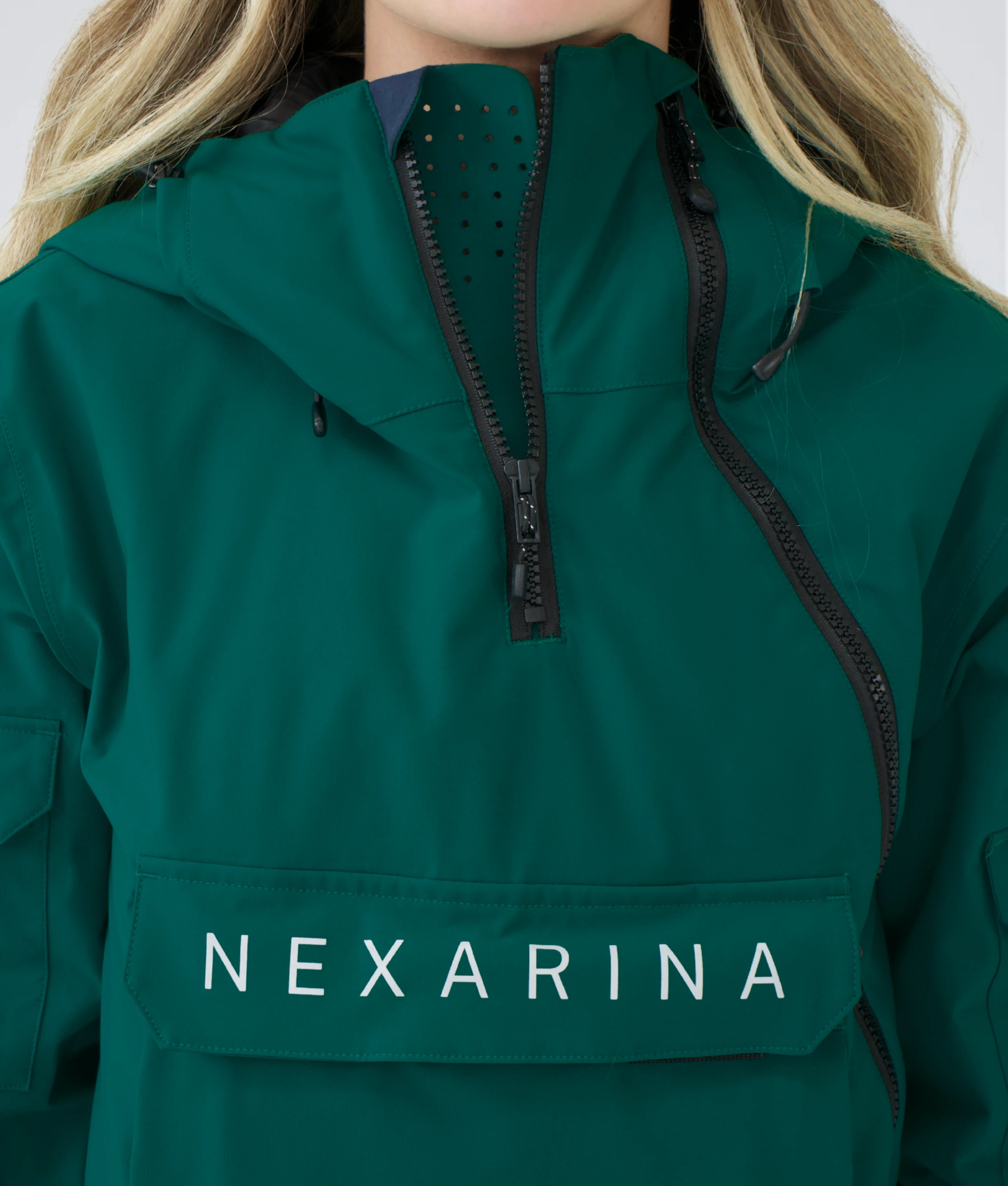 Close-up of Nexarina Indy Jacket in Emerald Green showing fabric texture, zippers, and premium finish.