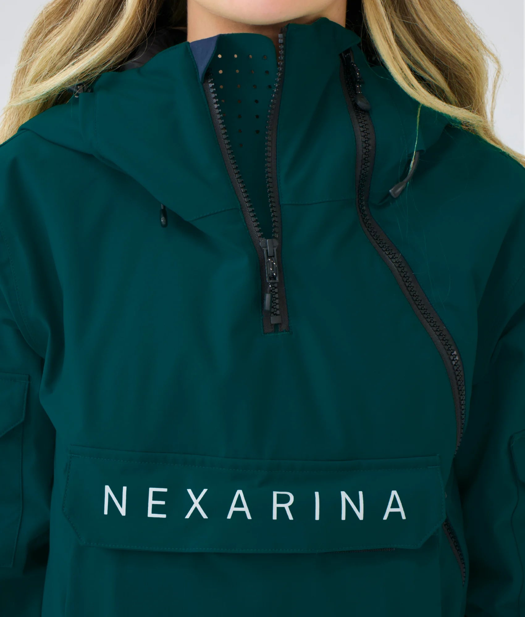 Close-up of Nexarina Indy Jacket in Emerald Green showing fabric texture, zippers, and premium finish.