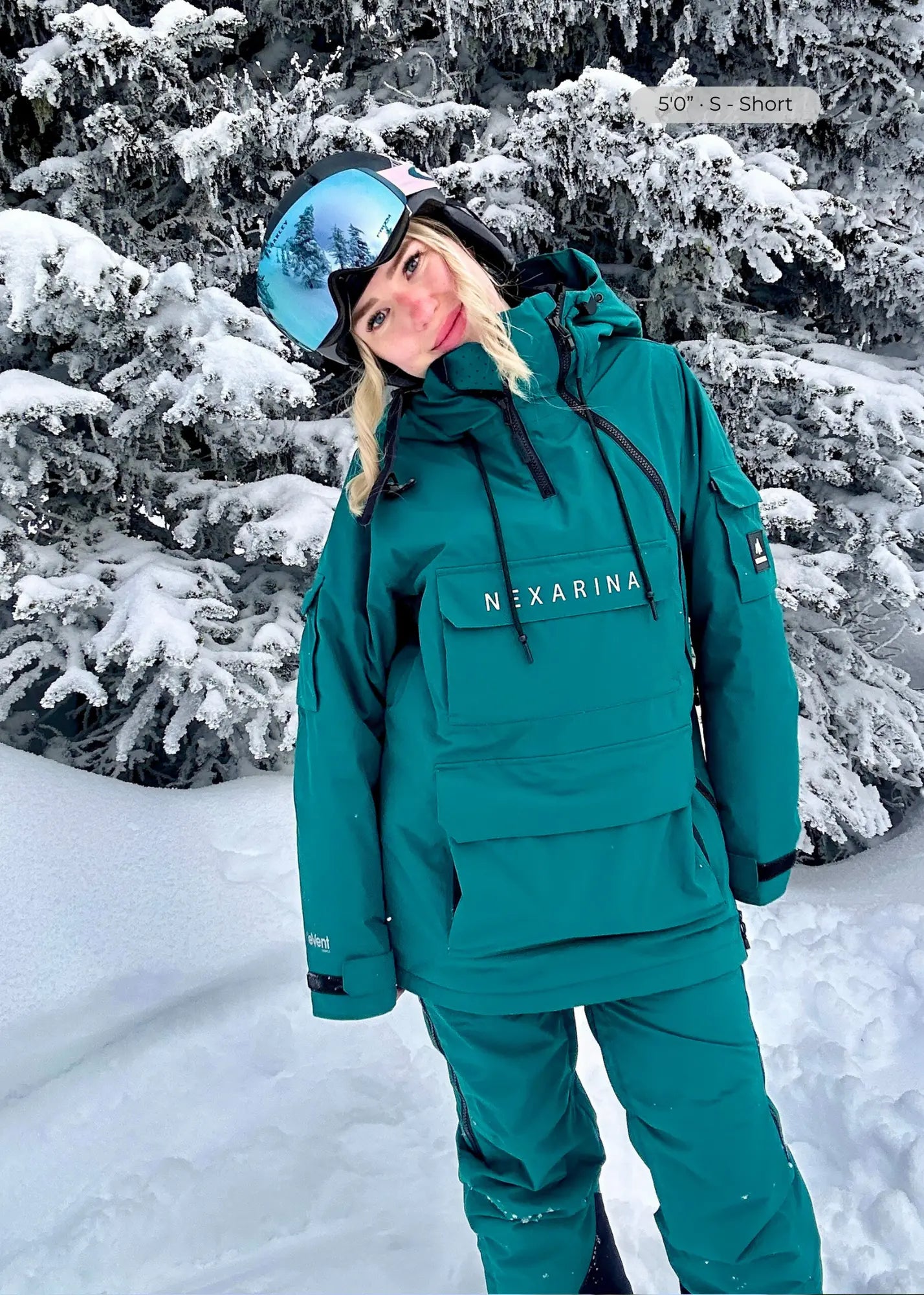 Nexarina Indy women's emerald green snowboard jacket lifestyle mountain shot
