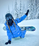 Woman wearing Nexarina Indy Snow Jacket and pants in Arctic Blue 