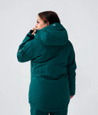 Curvy woman in Nexarina Indy Jacket in Emerald Green back view.