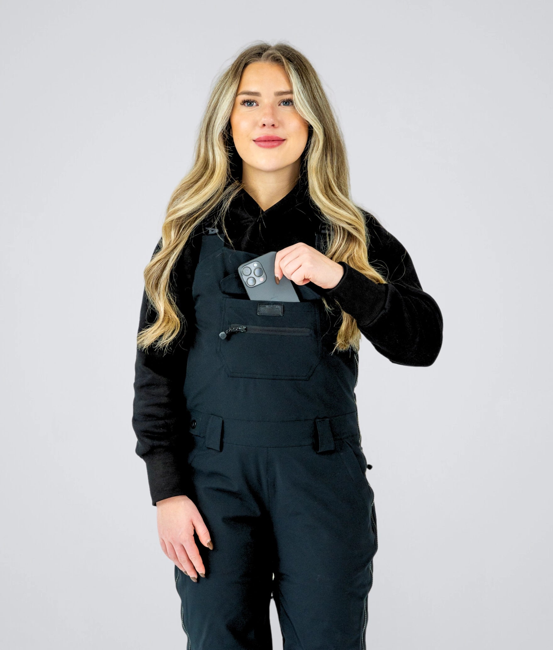 Front view of Nexarina Everette Bib highlighting performance fit and phone pocket.