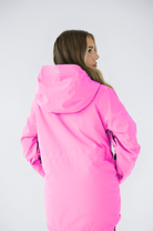 Rear view of a woman wearing a pink Nexarina jacket, highlighting the brand logo on the upper back against a plain white background.