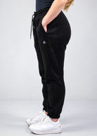 Side profile of Nexarina Willow Sweatpants showing the ribbed side panel